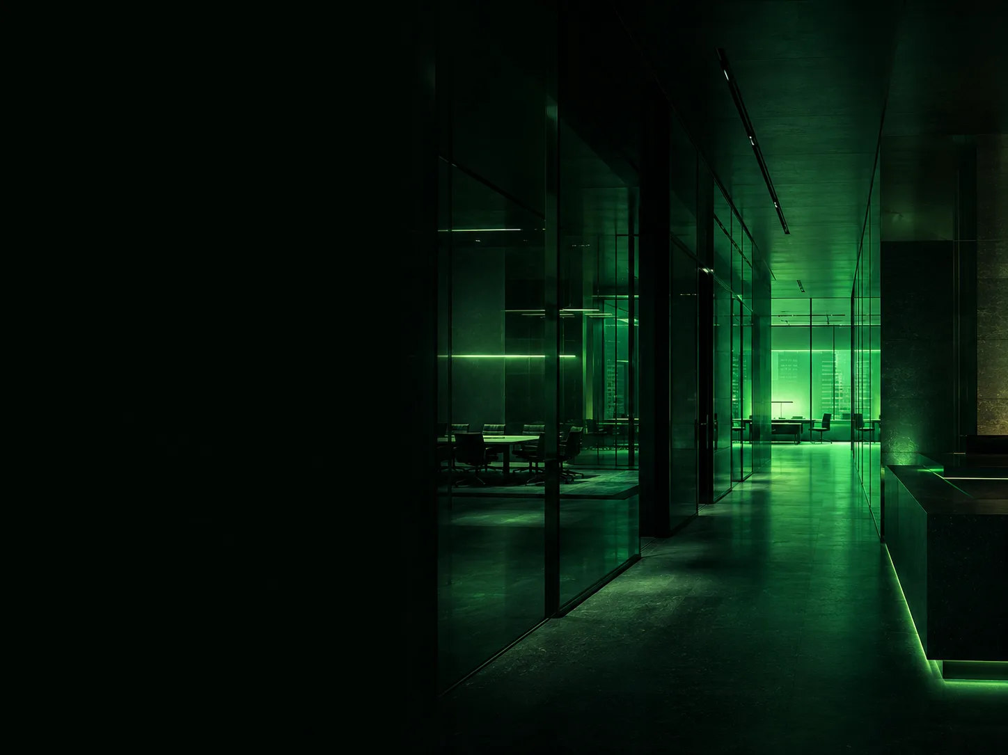 Glass-walled interior illuminated in emerald light